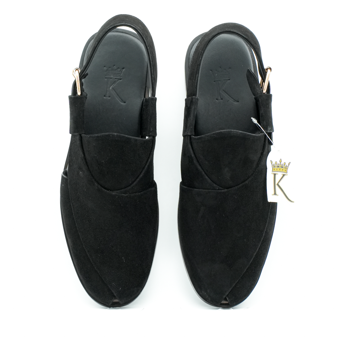 Khan The Brand Torkham Step Ahead sneaker, black and white athletic shoes with sporty design and lace-up style.
